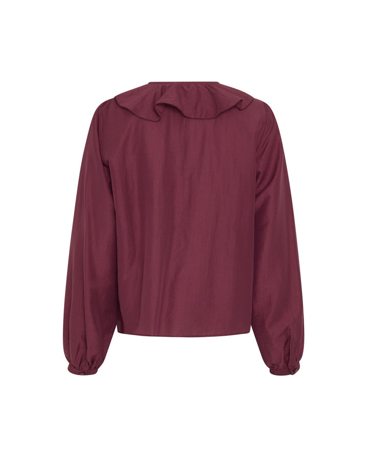Elegante Damenbluse mit Rüschen am V-Ausschnitt. Langarm-Design ideal für Büro- und Freizeit-Outfits.