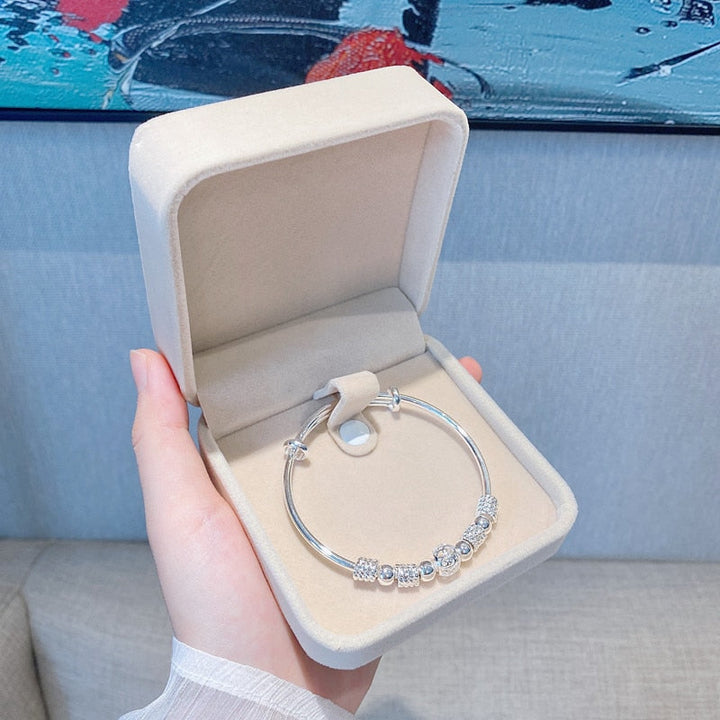 Silberarmband mit Glücksperlen für Damen, aus glänzendem 925er Sterlingsilber, verstellbar.
