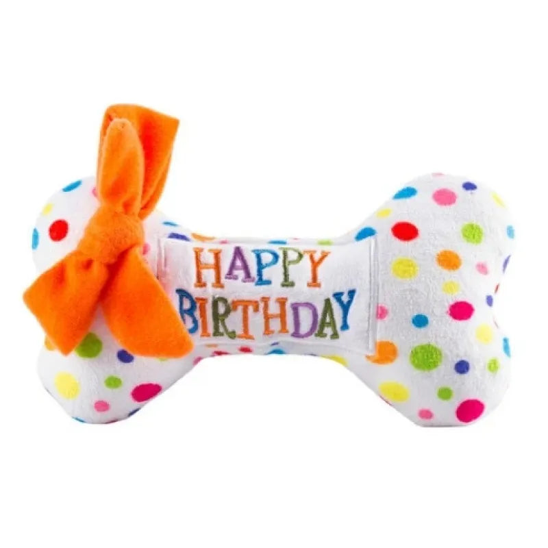 Komplettes Hundespielzeugset für Geburtstage: Ein weicher Plüschkuchen und ein Quietschknochen für Hunde.