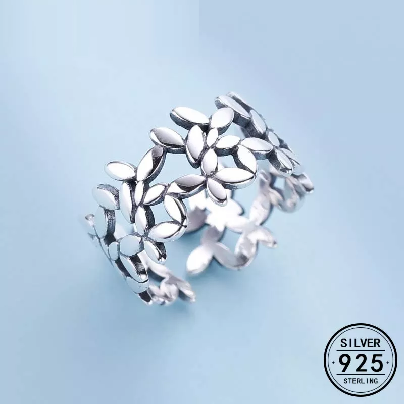 Verstellbarer Damen Blumenring aus Silber mit filigranem Muster, handgefertigt, elegantes Schmuckstück.