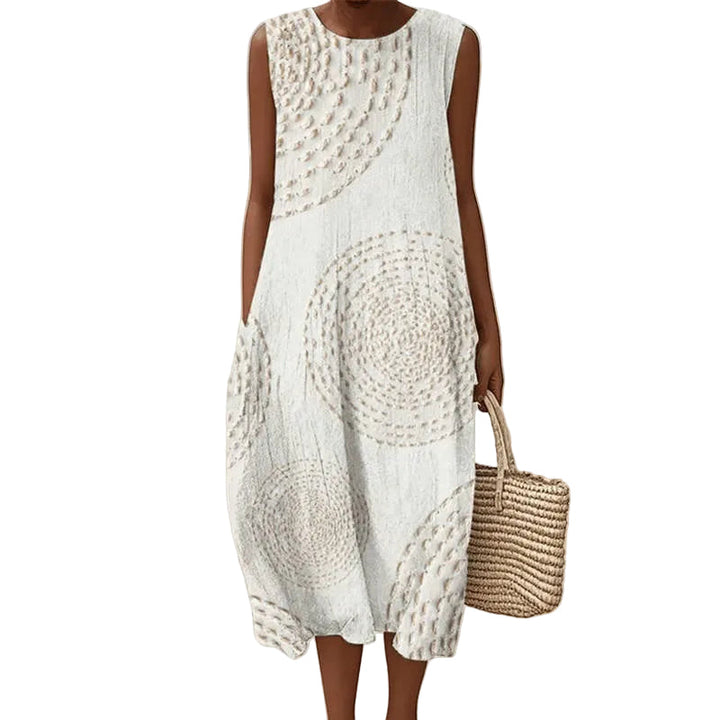 Damen Retro Midi-Kleid mit buntem Print, praktischen Taschen und Rundhals. Bequemes, luftiges Sommer-Freizeitkleid.