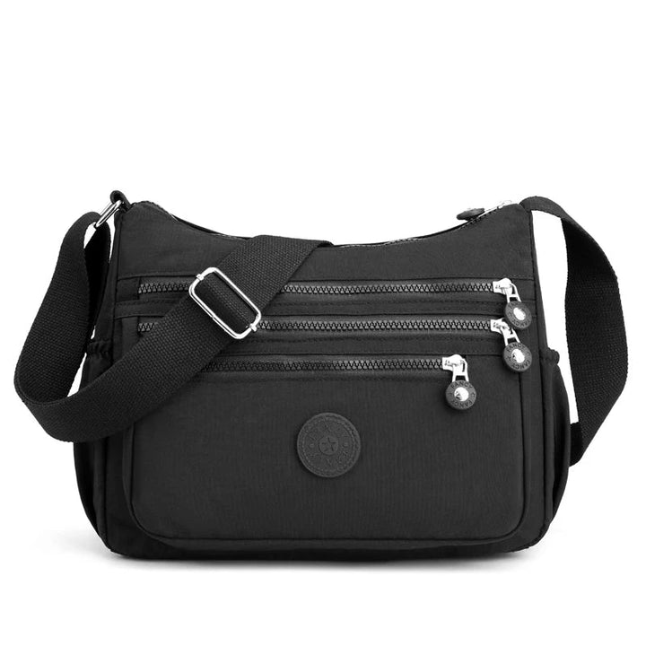 Moderne Damen Umhängetasche, wasserabweisend & vielseitig. Ideal als Messenger Bag für Arbeit oder Freizeit.