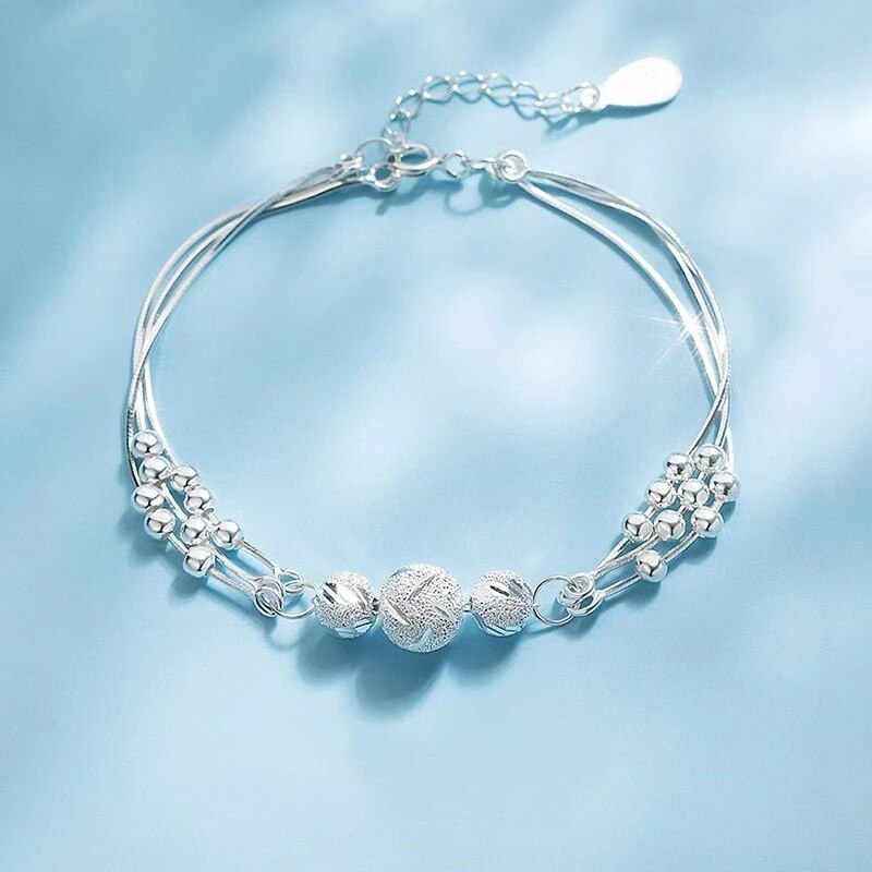 Damen Silbernes Perlenarmband aus Sterling Silber, eleganter Schmuck und moderner Glücksbringer.