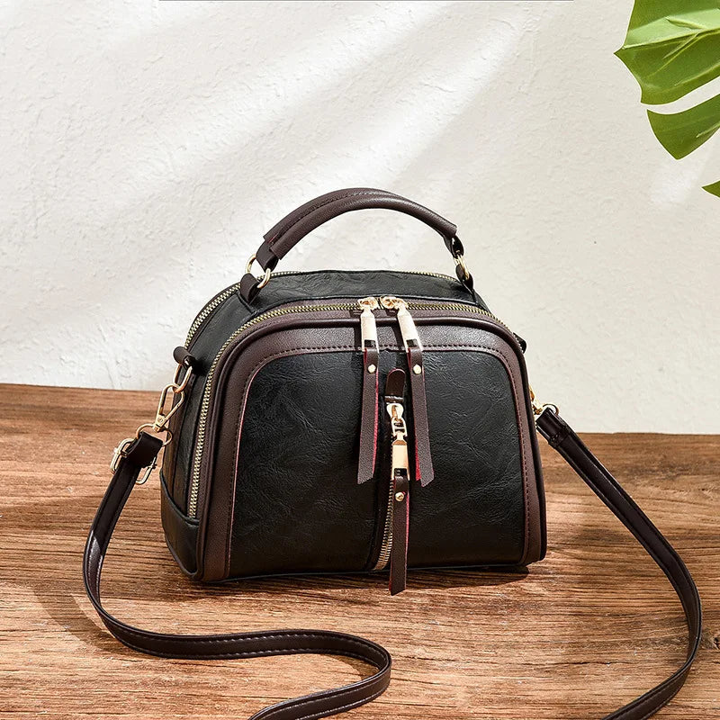 Elegante Damen Umhängetasche mit luxuriösem Alligator-Muster. Stilvolle Abendtasche im Designer-Look.