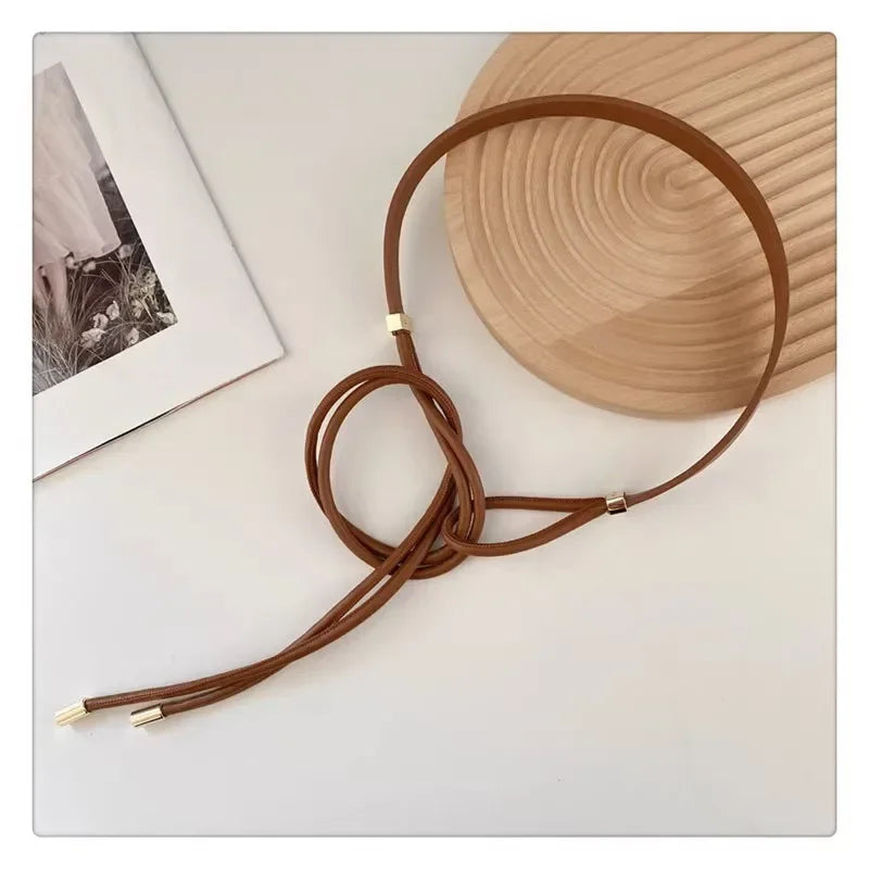 Schicker Damen Gürtel in Braun mit einzigartigem Knoten-Design als stilvolles Mode-Accessoire.