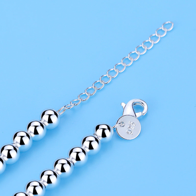 Modisches Damenarmband: 925er Silber mit Perlen und Herz, ideal für elegante Anlässe oder als Geschenk.