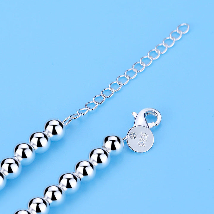 Modisches Damenarmband: 925er Silber mit Perlen und Herz, ideal für elegante Anlässe oder als Geschenk.