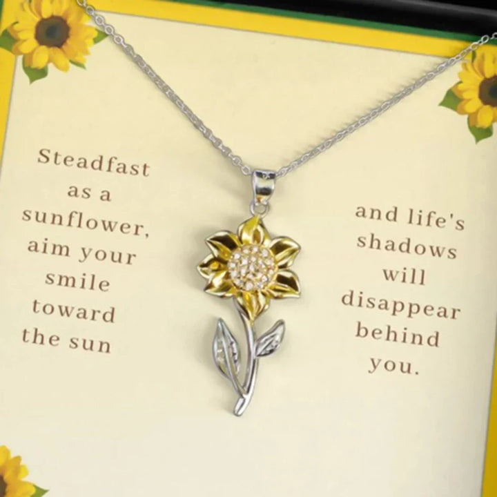 Elegante Statement-Halskette: goldene Sonnenblume mit Kristall. Modischer Damenschmuck für Positivität.