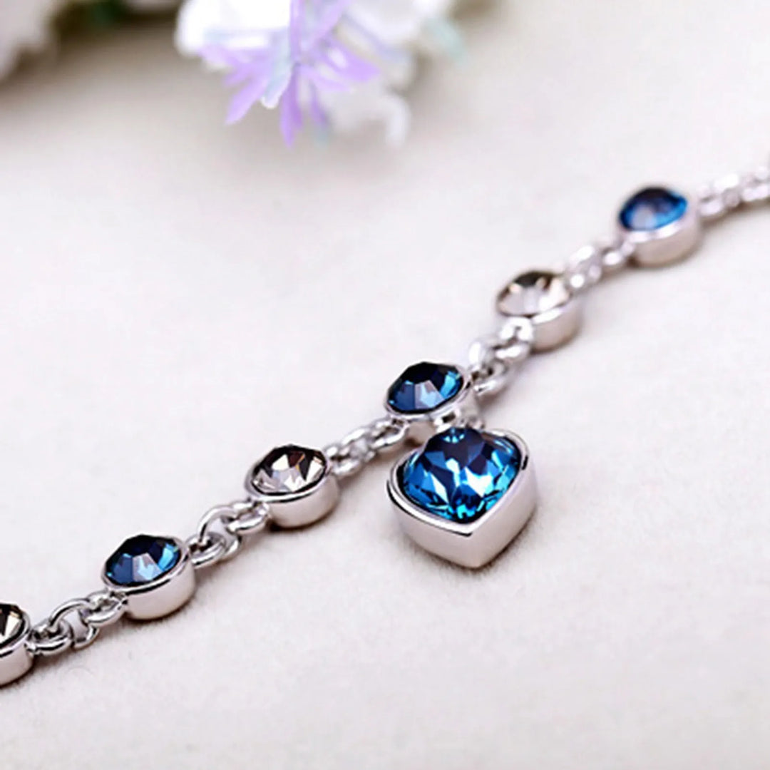 Luxuriöses Damenarmband mit Ozean-Motiv, Zirkonia-Kristallen und elegantem Herz-Anhänger.