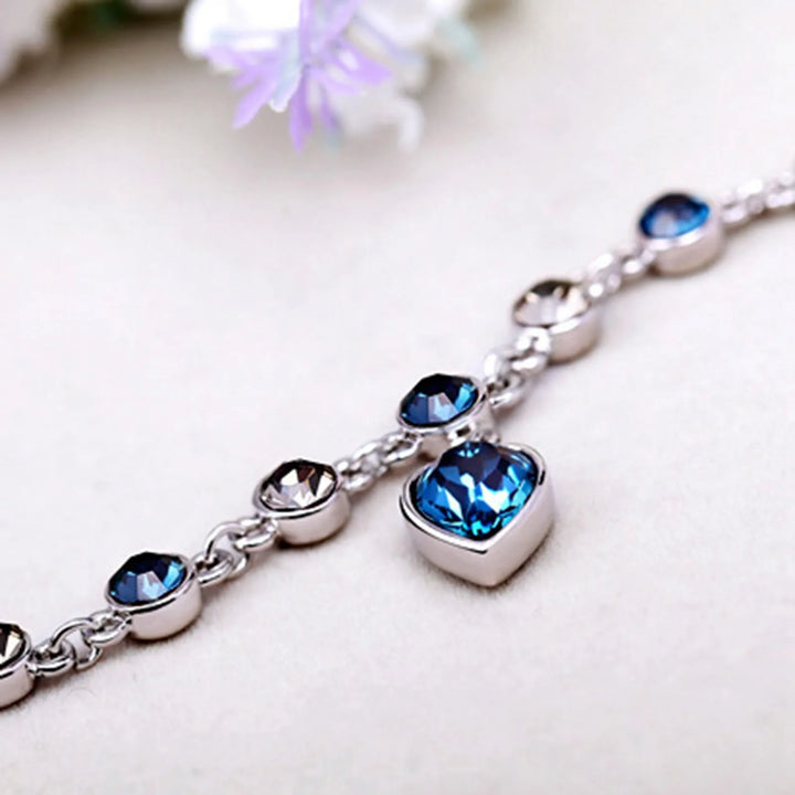 Luxuriöses Damenarmband mit Ozean-Motiv, Zirkonia-Kristallen und elegantem Herz-Anhänger.