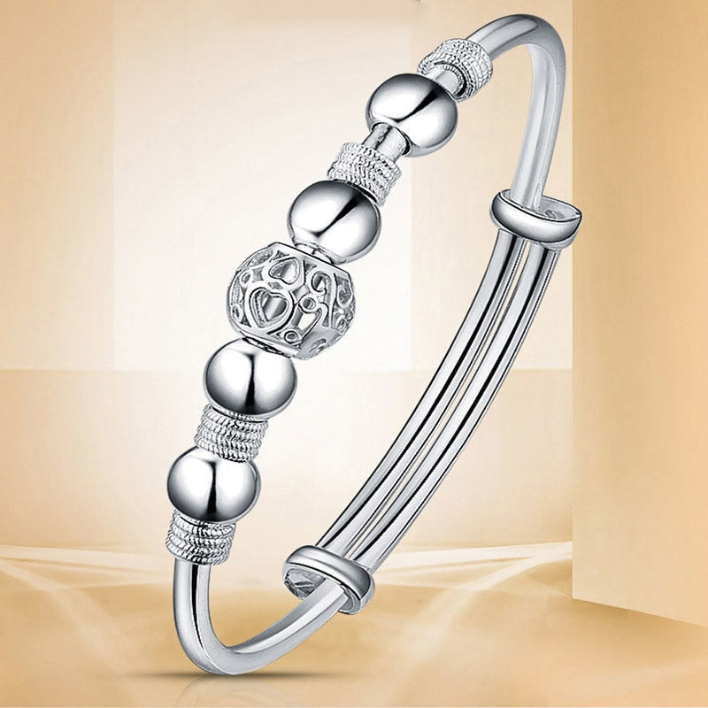 Verstellbares 925er Silberarmband für Damen, mit runden Glücksperlen, ideale Geschenkidee für Sie.