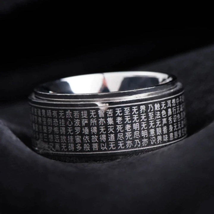 Rotierender Feng-Shui Zappelring aus glänzendem Edelstahl. Unisex Mantra Ring für Fokus & innere Ruhe.