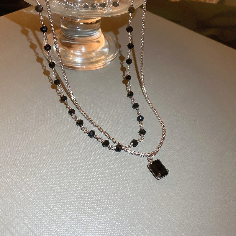 Schwarze Perlenkette auf Silber Doppelkette für Damen; ein vielseitiges Geschenk und trendiges Accessoire.