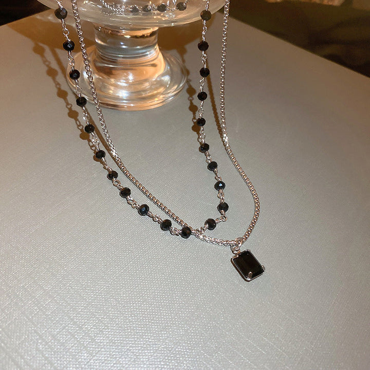 Schwarze Perlenkette auf Silber Doppelkette für Damen; ein vielseitiges Geschenk und trendiges Accessoire.