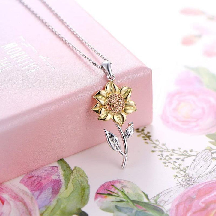 Goldene Sonnenblumenkette mit funkelndem Kristall-Anhänger für Damen, ein eleganter Glücksbringer.