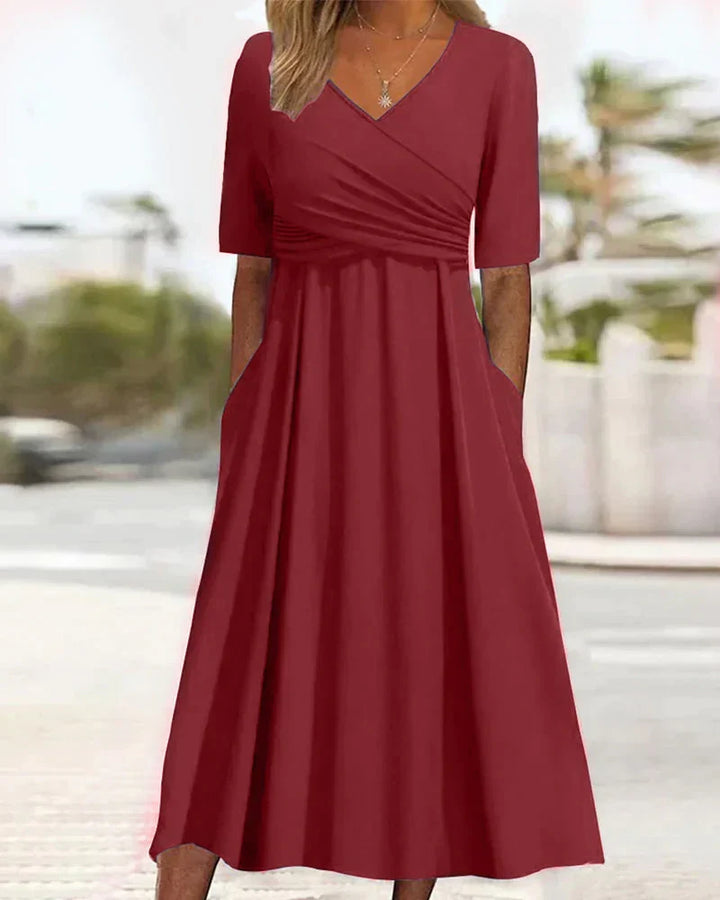 Elegantes Damen Wickelkleid mit V-Ausschnitt, figurbetont und kurzärmlig. Perfektes Sommer-Midikleid in Unifarbe.