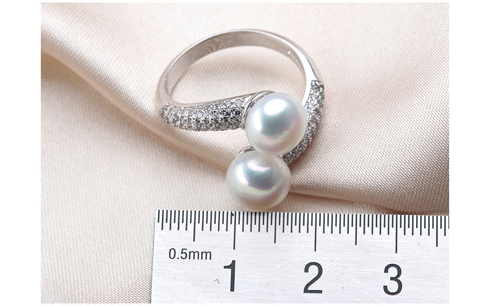 Hochwertiger Damen-Silberring mit echter Süßwasserperle, verstellbar, filigranes Design, 925er Qualität.