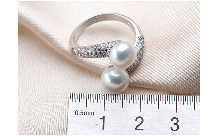 Hochwertiger Damen-Silberring mit echter Süßwasserperle, verstellbar, filigranes Design, 925er Qualität.