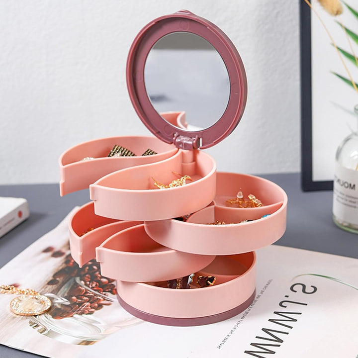 Eleganter drehbarer Schmuckkasten in Rosa und Blau, ideal zur stilvollen Aufbewahrung Ihrer Accessoires.
