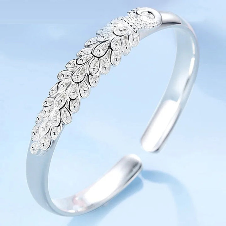 Exquisites 925er Silberarmband für Damen mit detailliertem Pfauen-Design, ideal als Geschenk.