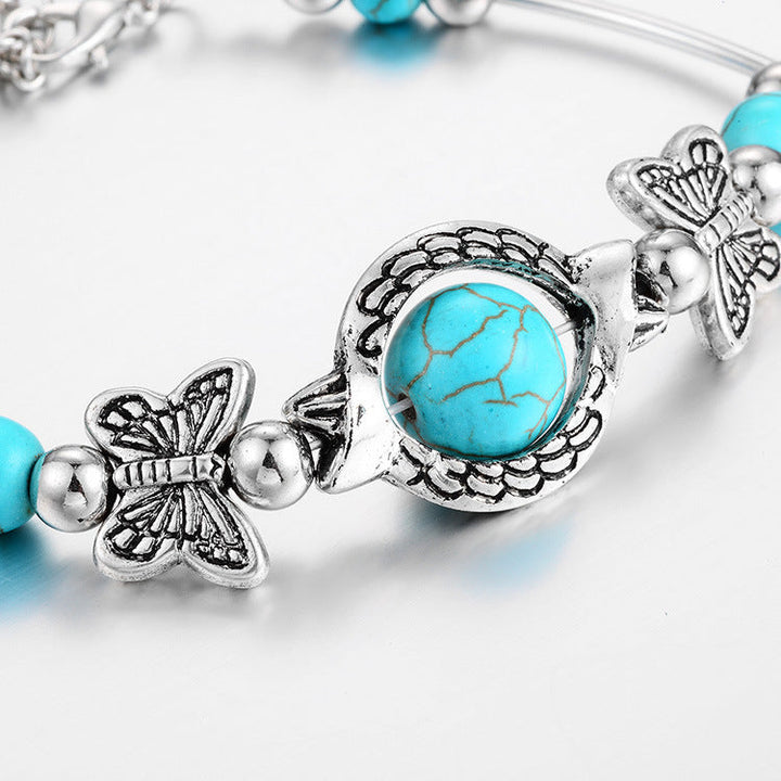 Stilvolles Damen Armband aus Türkisperlen mit filigranem Schmetterling, perfektes Accessoire oder Geschenk.