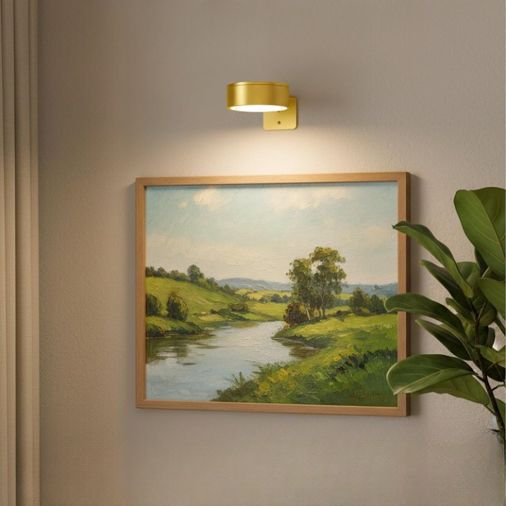 Elegante goldene LED Bilderleuchte, kabellos und dimmbar, mit magnetischer Halterung.