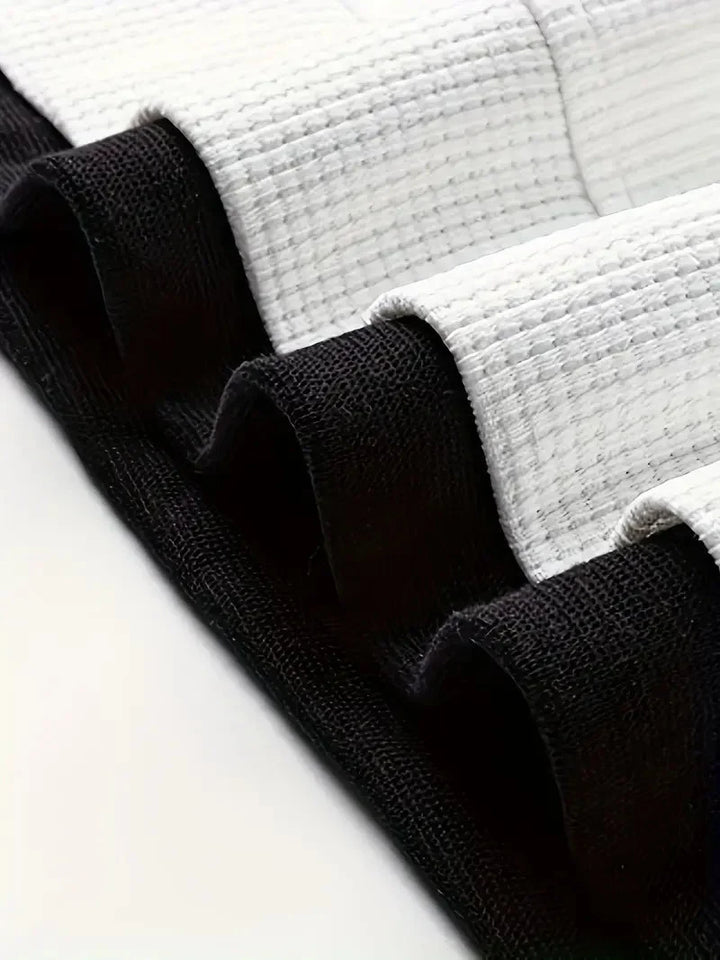 Modernes Herren Waffelstrick-Set: Lässiges T-Shirt & Shorts, perfekt für den Strand oder Stadt.