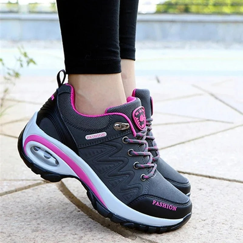 Rosa orthopädische Damen-Sneakers mit Haltungskorrektur. Bequeme Schuhe für Fußgesundheit.