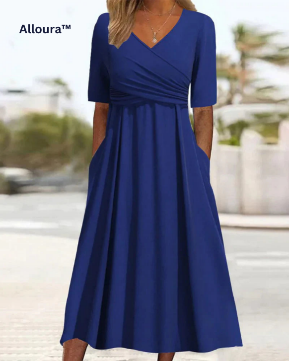Leichtes Damen Wickel-Midikleid mit V-Ausschnitt und kurzen Ärmeln. Figurbetontes Sommerkleid, ideal für Freizeit.