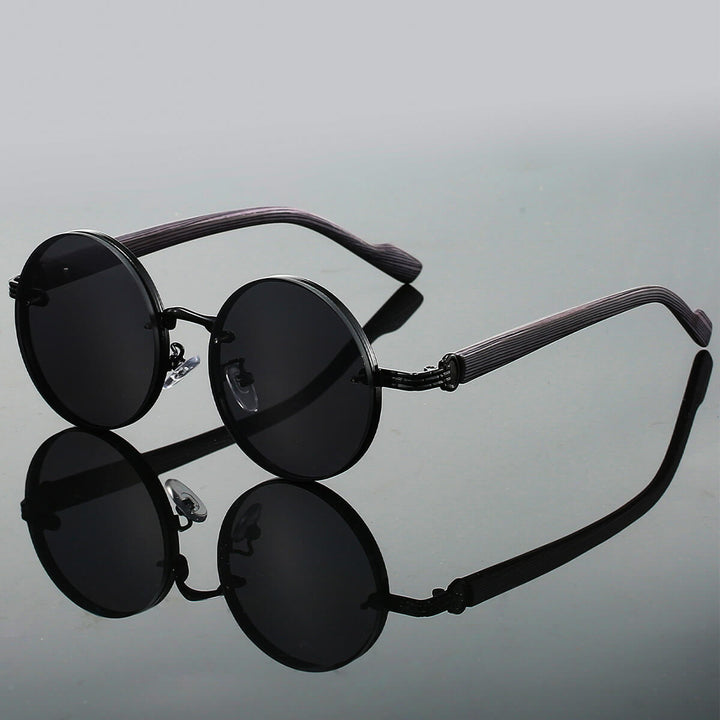 Runde Retro Sonnenbrille mit UV400 Schutz. Leichtes Metallgestell für Damen & Herren, ideal für sonnige Sommertage.