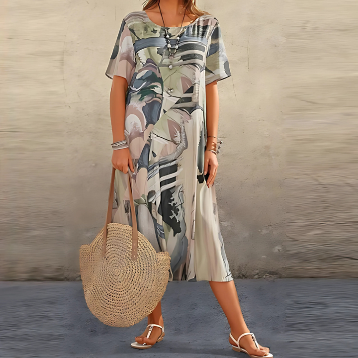 Leichtes Damen Blumenkleid, Kurzarm, mit lebhaftem Allover-Print. Fließendes Midikleid ideal für warme Sommertage.