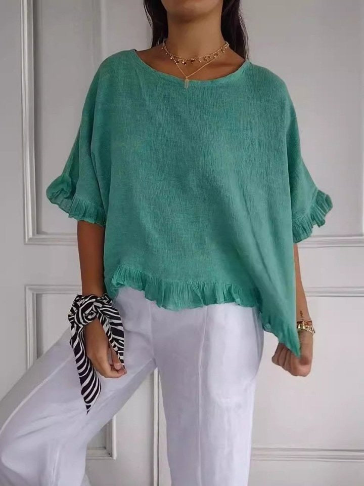 Modische Damenbluse, elegant mit Rüschensaum, Rundhals und 3/4-Arm. Perfekt für Freizeit.