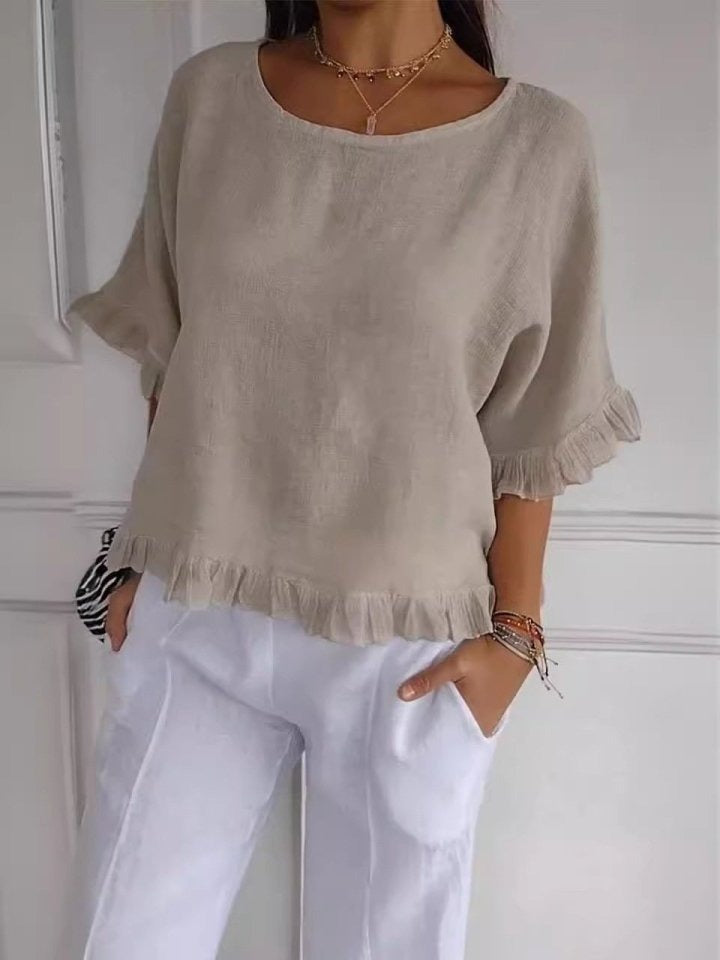 Schicke Damenbluse: Rüschensaum, Rundhals, 3/4-Arm. Elegante Casual-Bluse für Frühling und Sommer.