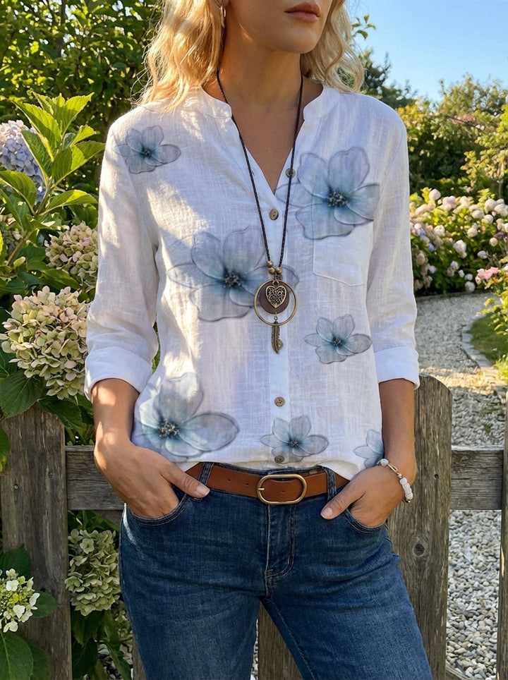 Modische Damen Blusenjacke für den Sommer, mit Blumenprint, Knopfleiste und 3/4 Ärmeln.