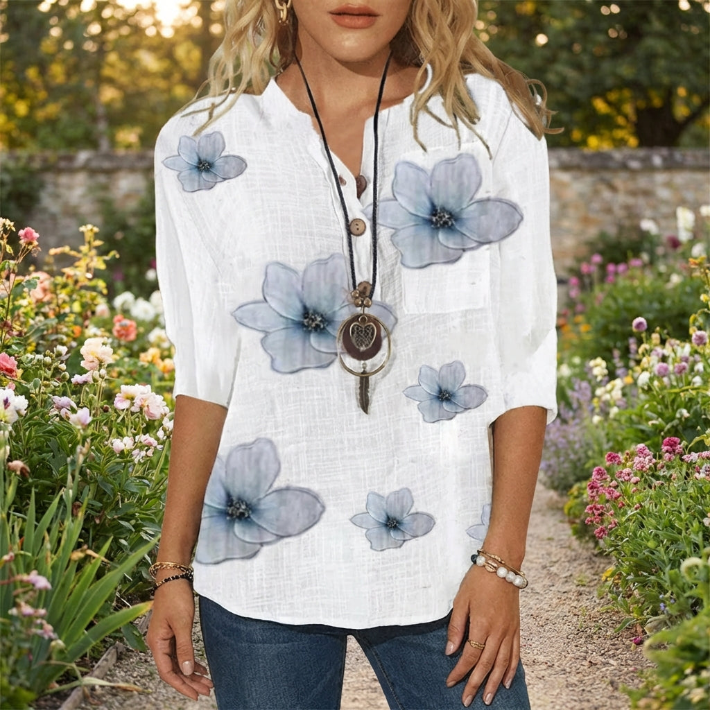 Damen Blusenjacke in hellem Stoff mit floralem Muster, Knopfleiste vorne, perfekt für Frühling.