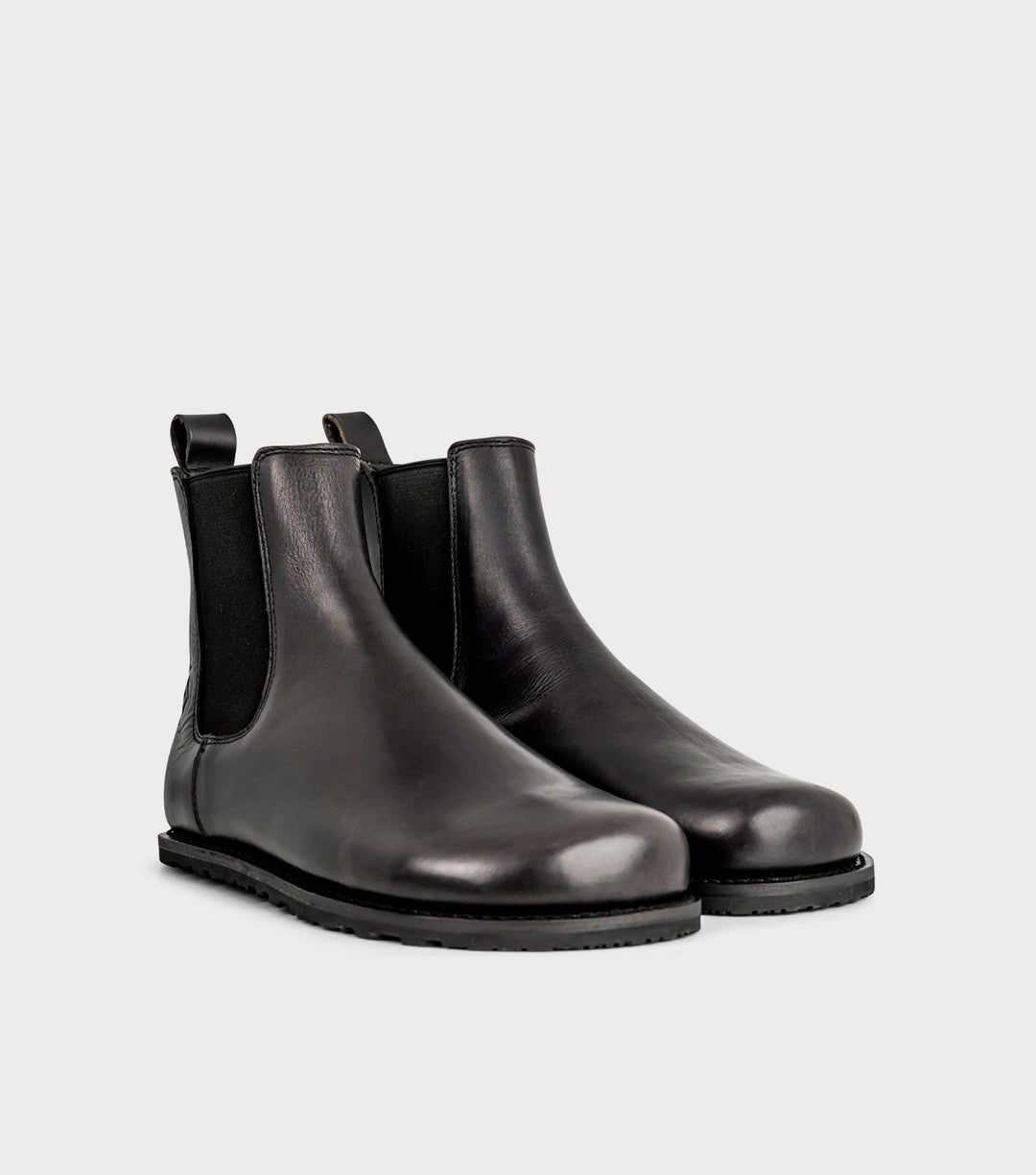 Unisex Chelsea Barfuß-Stiefeletten in Schwarz, elegant und bequem, mit breiter Passform für natürlichen Gehkomfort.