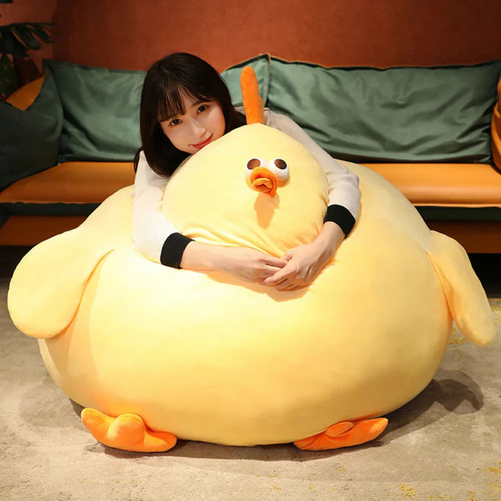 Flauschiges gelbes Kuschelhuhn Plüschtier, ideal als Deko oder Spielzeug im Kinderzimmer.