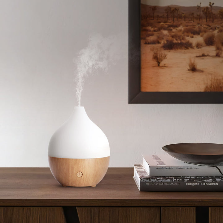 Beruhigender Mini Aroma Diffuser mit Kaltnebel, LED-Licht & Schlafmodus für wohlige Entspannung.