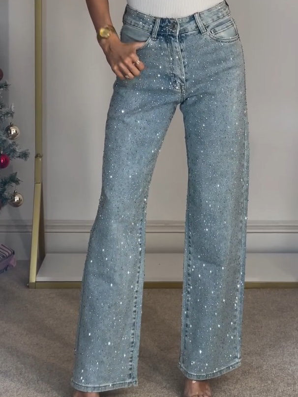 Figurstreckende Damen-Schlagjeans mit eleganten Glitzer-Details. Hochgeschnittene Denimhose für stilvolle Looks.