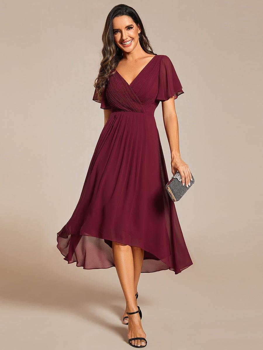 Smaragdgrünes Vokuhila Abendkleid für Damen, elegant & festlich für Hochzeiten oder besondere Anlässe.
