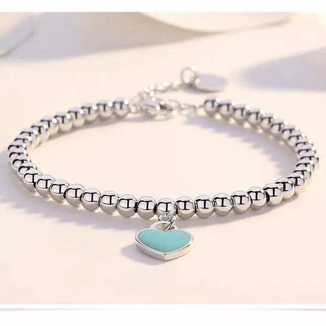 Eleganter Damen Perlenschmuck: 925er Silber Herzarmband mit zarten Perlen. Perfekte Geschenkidee.