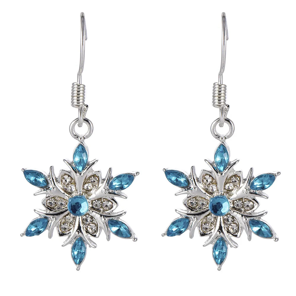 Damen-Schneeflocken-Ohrringe mit blauen Strasssteinen. Eleganter Winterschmuck für festliche Anlässe.