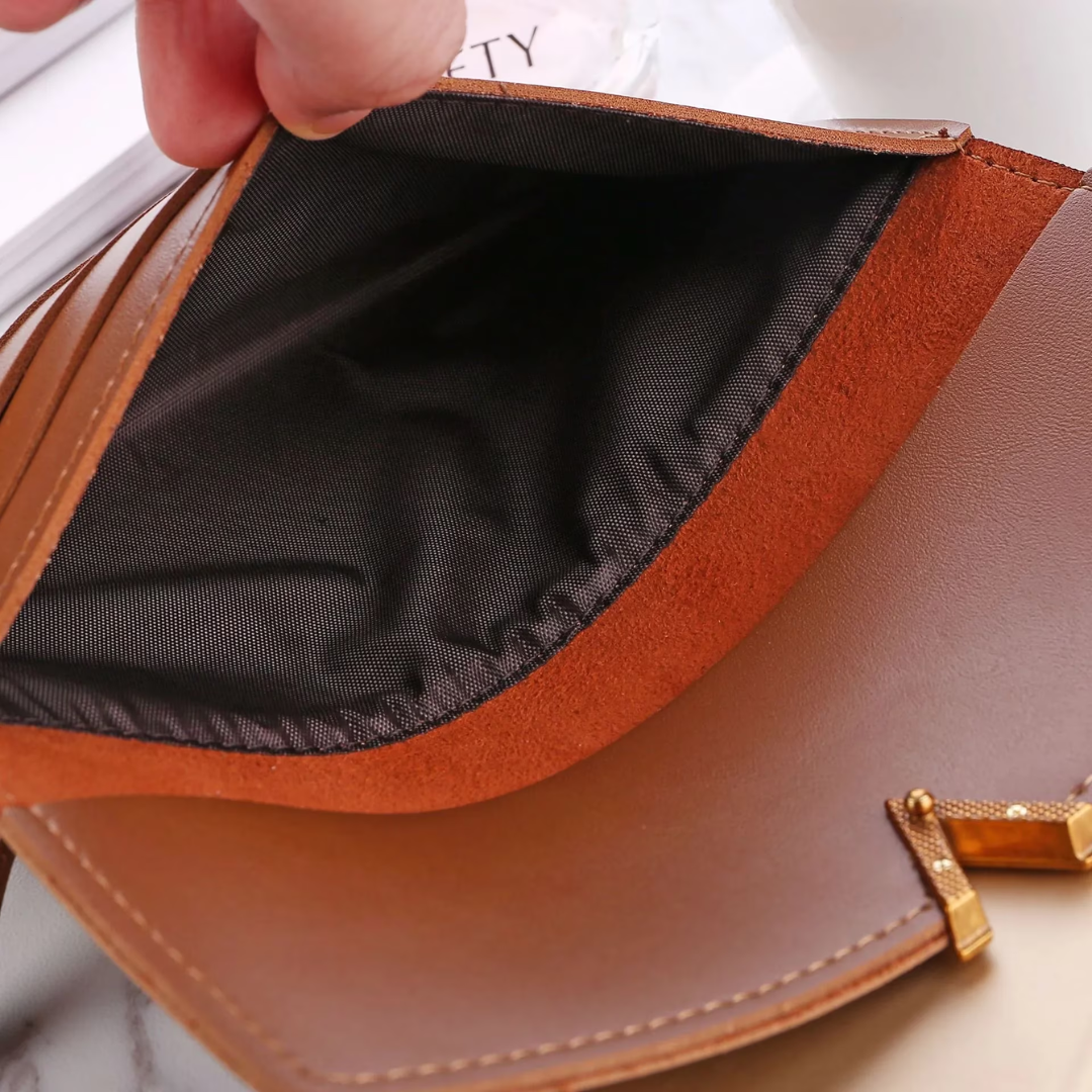 Hochwertige lange Unisex-Geldbörse aus Leder, schwarz, mit stilvollem Goldverschluss.