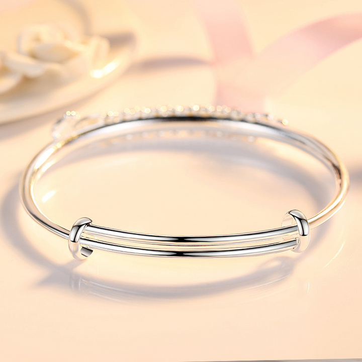 Damen Silberarmband mit mythischem Phönix, verstellbar. Elegantes Schmuckstück, Symbol für Widerstandsfähigkeit.