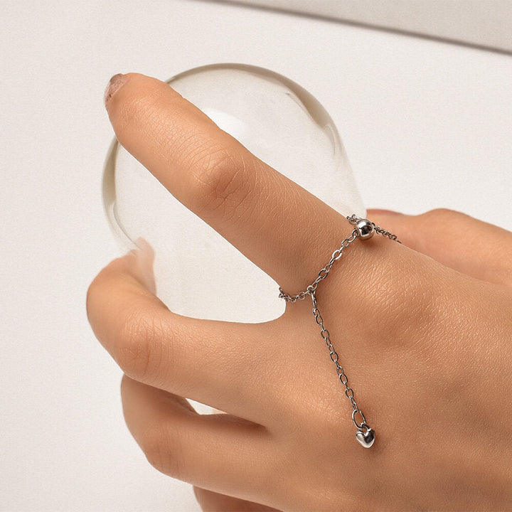 Moderner verstellbarer Herzring für Frauen, Silberschmuck mit stilvollen Quasten.