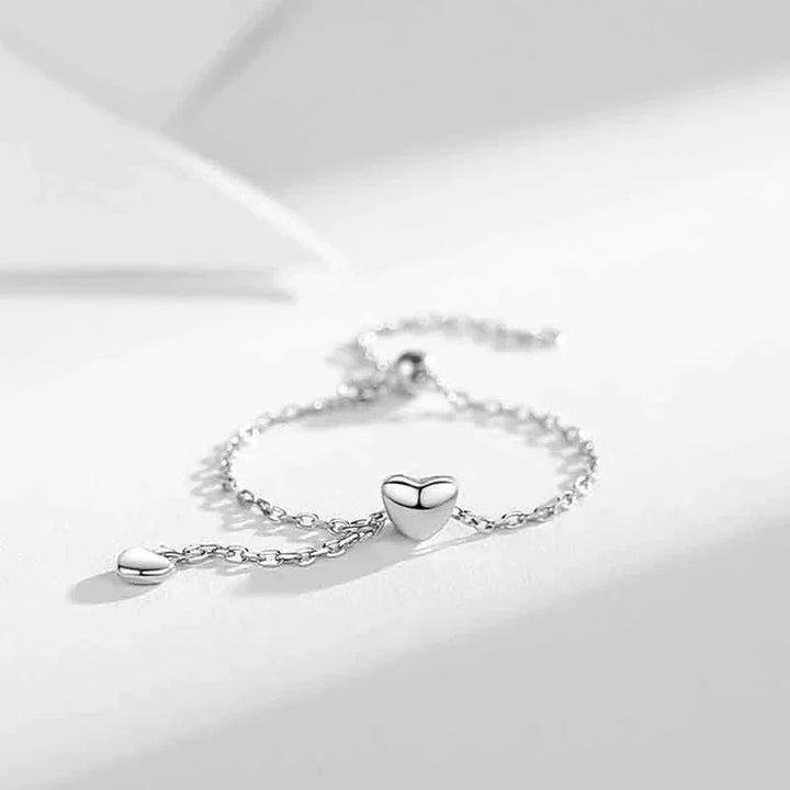 Romantischer Silber-Herzring für Damen mit charmanten Quasten, ideal als Geschenk.