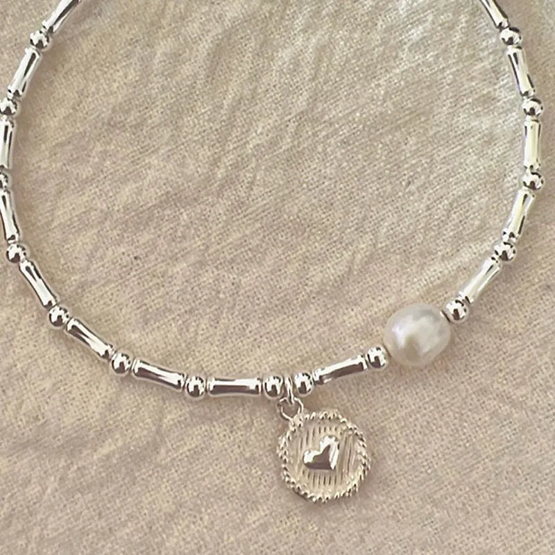 Hochwertiges Sterling Silber Bambus Perlenarmband für Damen, zeitloser Schmuck mit edler Ausstrahlung und Stärke.