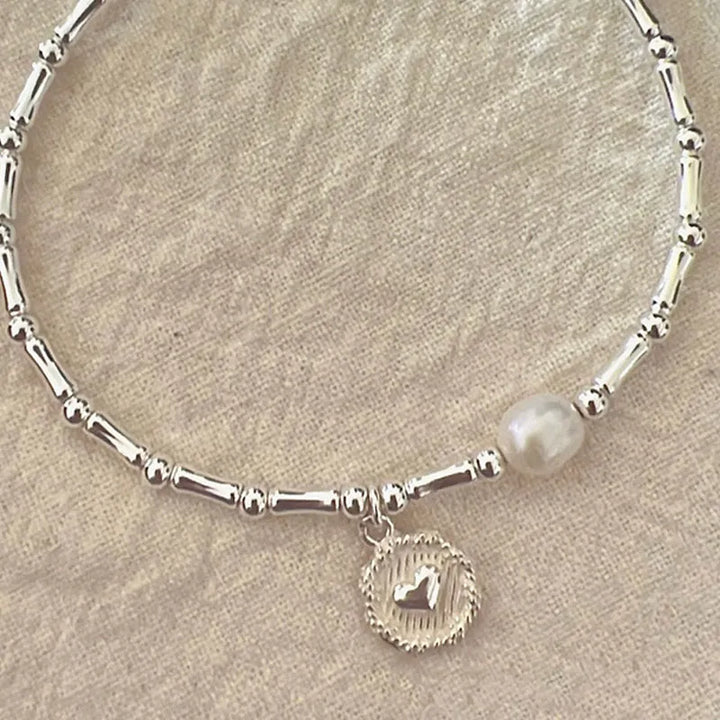 Hochwertiges Sterling Silber Bambus Perlenarmband für Damen, zeitloser Schmuck mit edler Ausstrahlung und Stärke.