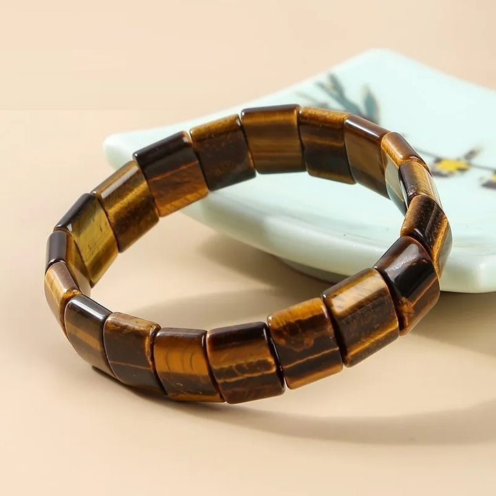 Handgefertigtes Unisex Edelsteinarmband mit dreifarbigem Tigerauge. Bringt Stärke, Klarheit & positive Energie.
