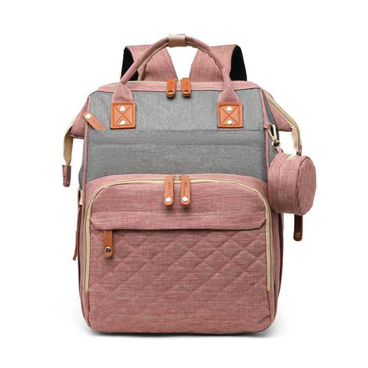 Robuster Babyrucksack, der sich in ein bequemes Wickelbett für unterwegs verwandelt. Multifunktionale Elterntasche.